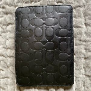 Black case for a mini iPad or tablet.